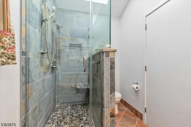 a spacious bedroom with a bed and a window