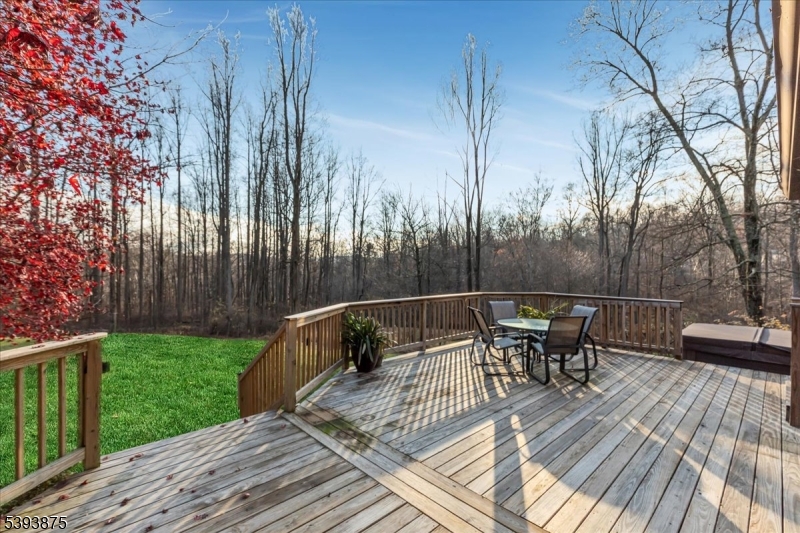 71 Sliker Road Glen Gardner, NJ 08826 - Photo 20 of 50 a view of backyard with table and chairs and wooden floor