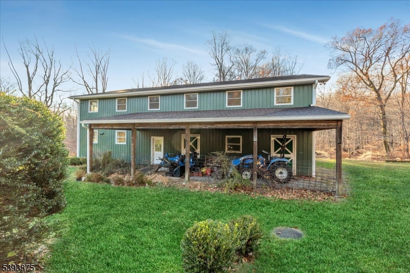 71 Sliker Road Glen Gardner, NJ 08826 - Photo 21 of 50 a front view of a house with garden and porch