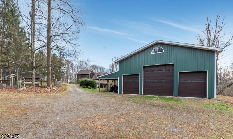 71 Sliker Road Glen Gardner, NJ 08826 - Photo 22 of 50 a front view of a house with a yard and garage