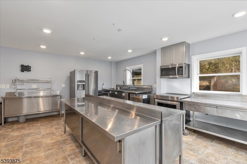71 Sliker Road Glen Gardner, NJ 08826 - Photo 24 of 50 a large kitchen with stainless steel appliances granite countertop a lot of counter space and a sink