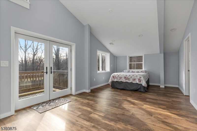 71 Sliker Road Glen Gardner, NJ 08826 - Photo 28 of 50 a bedroom with a bed and wooden floor