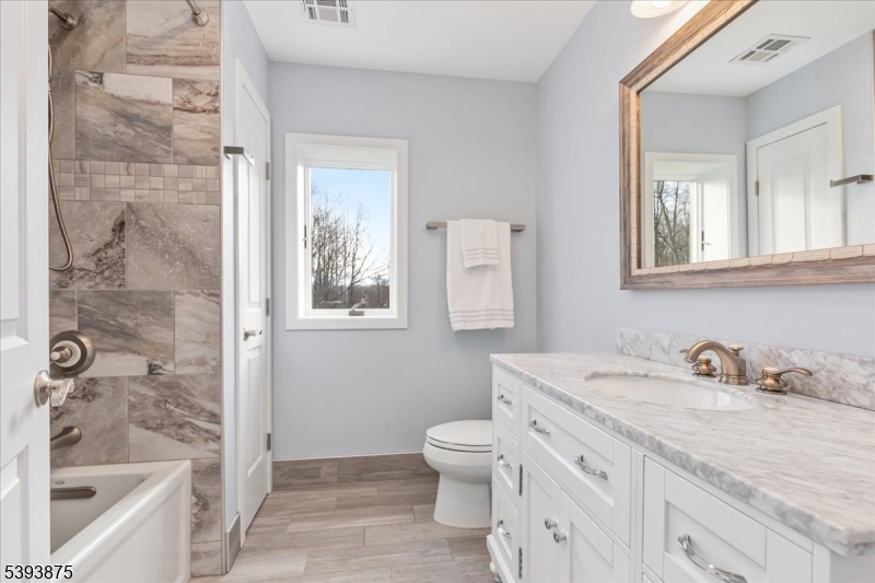 71 Sliker Road Glen Gardner, NJ 08826 - Photo 29 of 50 a bathroom with a sink a toilet and shower