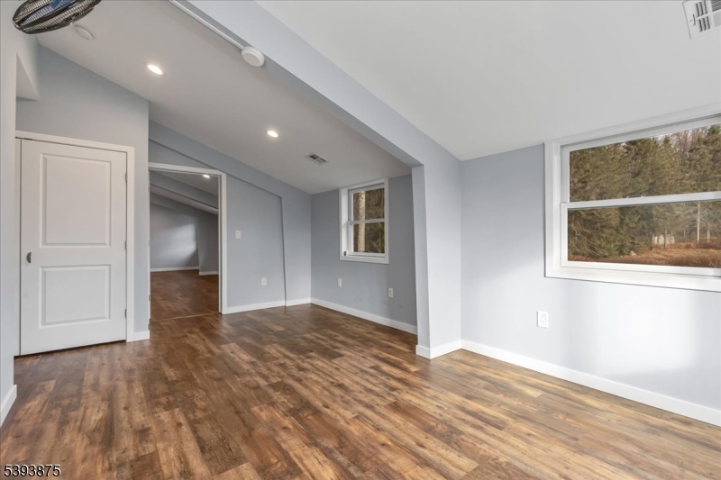 71 Sliker Road Glen Gardner, NJ 08826 - Photo 30 of 50 a view of empty room with wooden floor and fan
