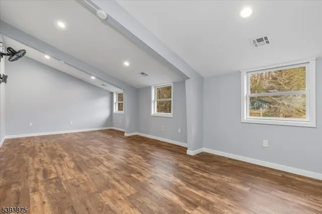 a view of a room with wooden walls