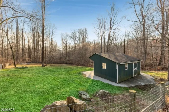 a view of house with backyard