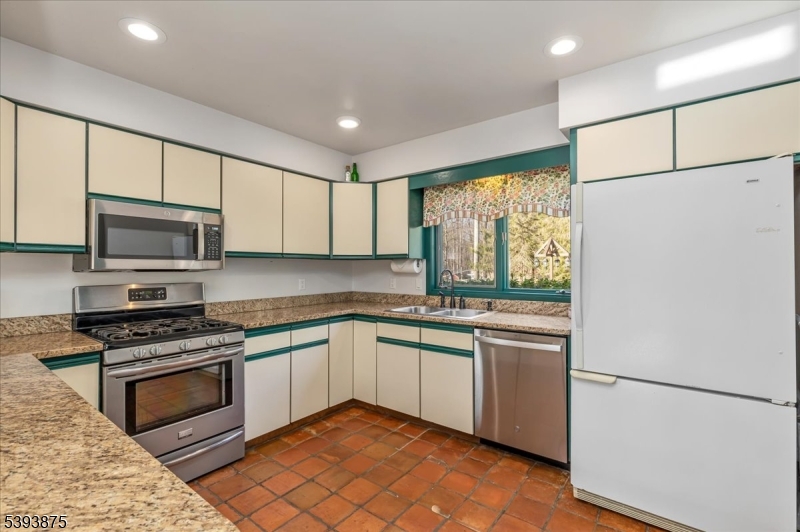 71 Sliker Road Glen Gardner, NJ 08826 - Photo 9 of 50 a kitchen with stainless steel appliances a stove sink and microwave