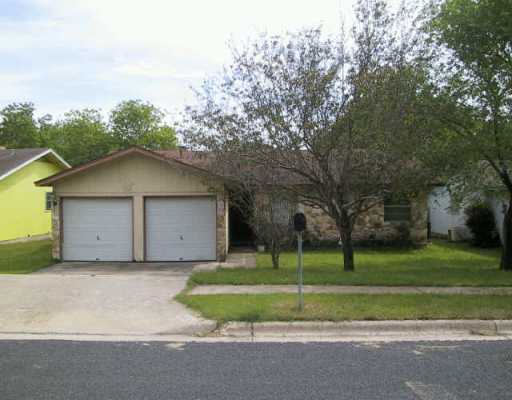 4905 Parell Path Austin, TX 78744 - Photo 1 of 1 a view of a house with a yard and large trees
