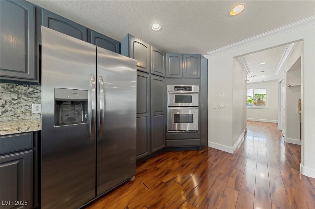 144 East Robindale Road Las Vegas, NV 89123 - Photo 11 of 48 Stainless appliances. Electric cooktop.
