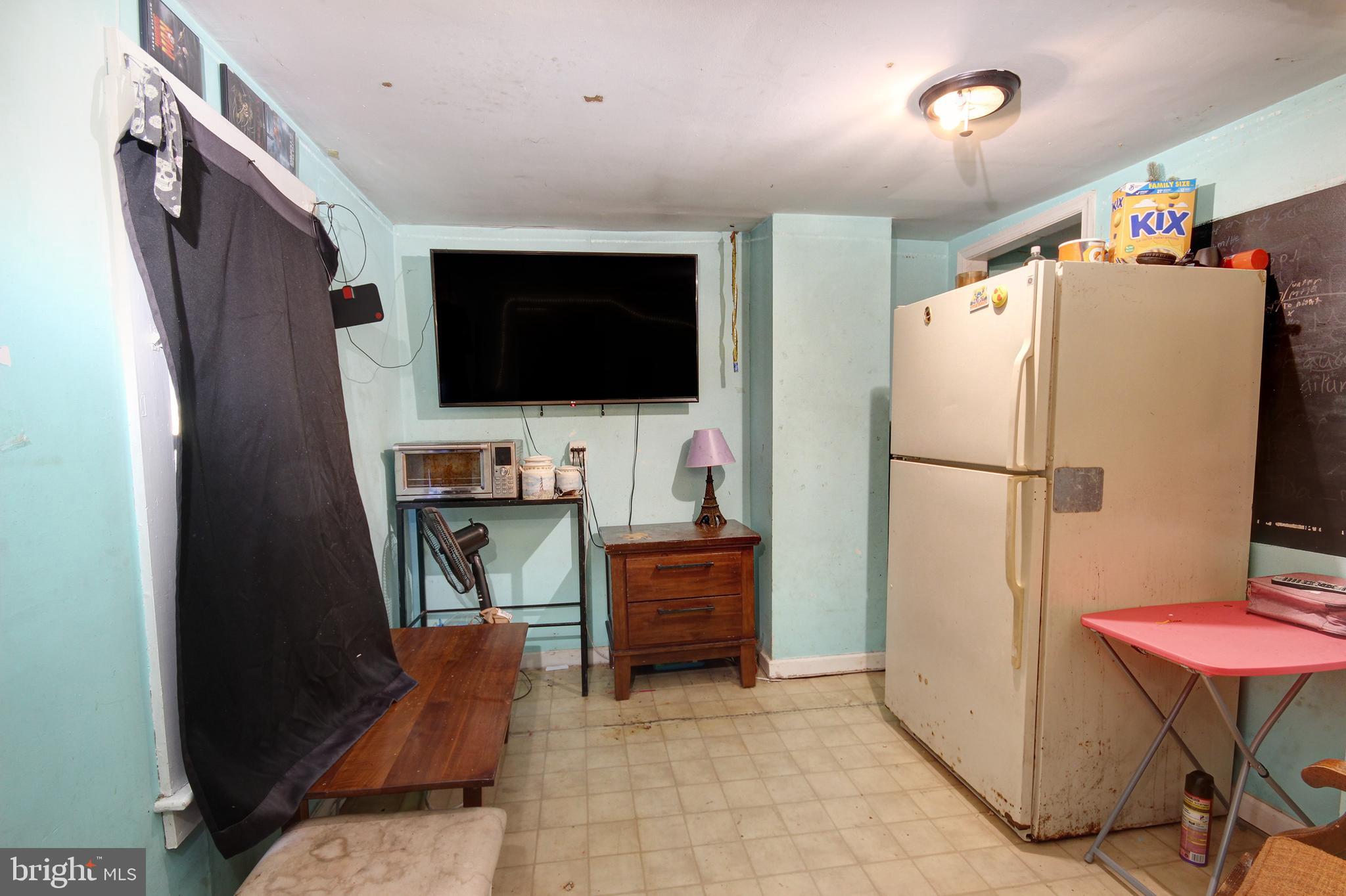 11 West Chestnut Street Delmar, MD 21875 - Photo 12 of 14 a kitchen with stainless steel appliances a refrigerator and a stove top oven