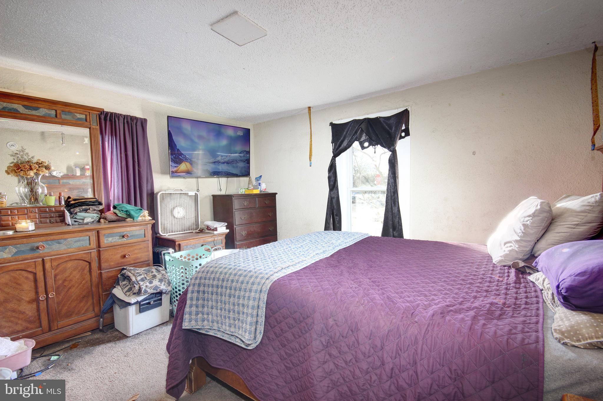 11 West Chestnut Street Delmar, MD 21875 - Photo 7 of 14 a bedroom with a bed and wooden floor