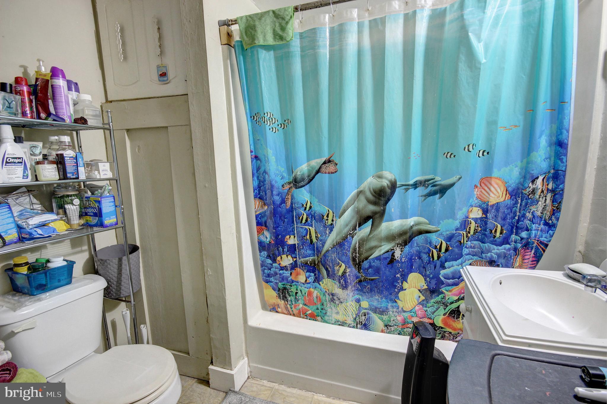 11 West Chestnut Street Delmar, MD 21875 - Photo 9 of 14 a bathroom with a sink mirror vanity and toilet