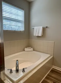 a bathroom with a sink and a window