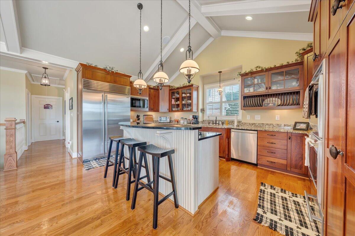400 Quail Ridge Drive Fincastle, VA 24090 - Photo 24 of 113 a kitchen with stainless steel appliances granite countertop a sink and a refrigerator