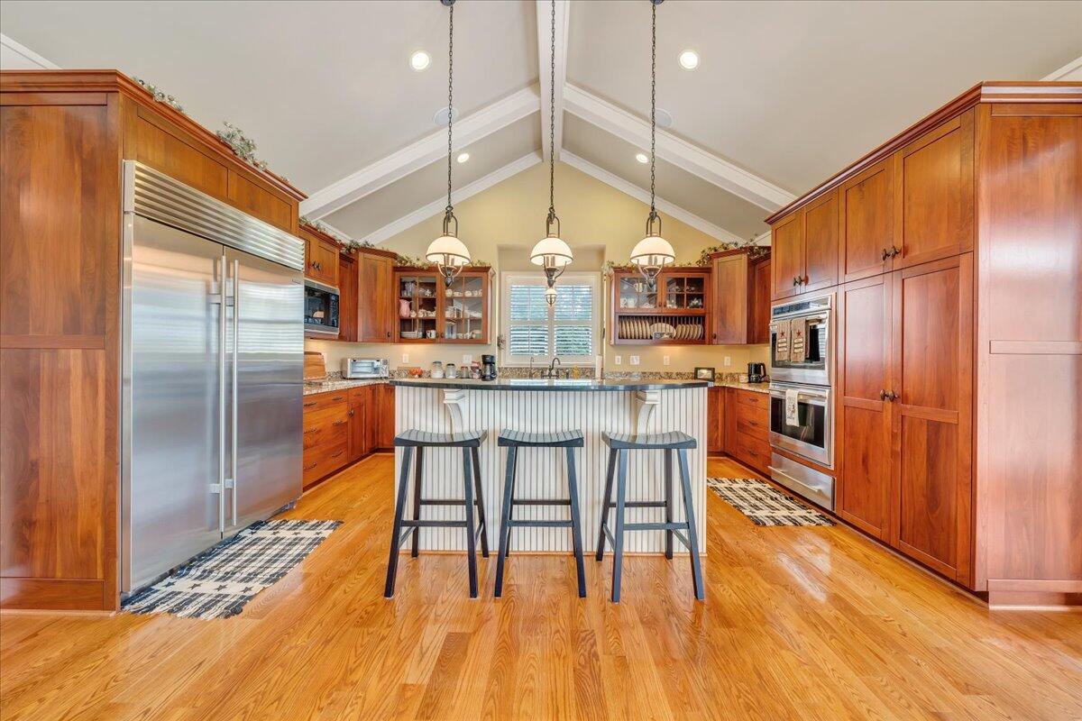 400 Quail Ridge Drive Fincastle, VA 24090 - Photo 28 of 113 a kitchen with stainless steel appliances a dining table chairs sink and wooden floor