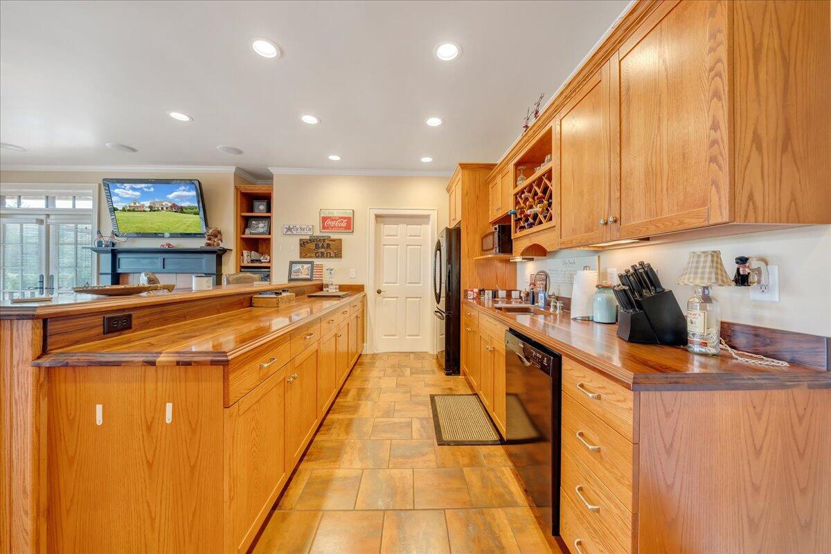 400 Quail Ridge Drive Fincastle, VA 24090 - Photo 46 of 113 a kitchen with stainless steel appliances granite countertop a sink and cabinets