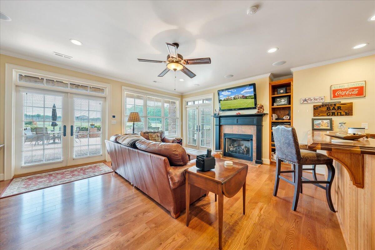 400 Quail Ridge Drive Fincastle, VA 24090 - Photo 47 of 113 a living room with fireplace furniture and a floor to ceiling window