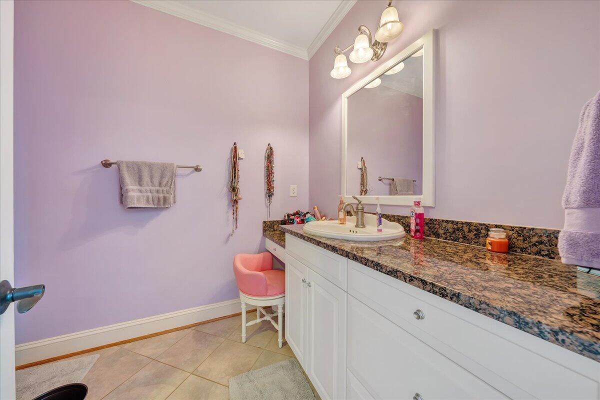 400 Quail Ridge Drive Fincastle, VA 24090 - Photo 51 of 113 a bathroom with a granite countertop sink and a mirror