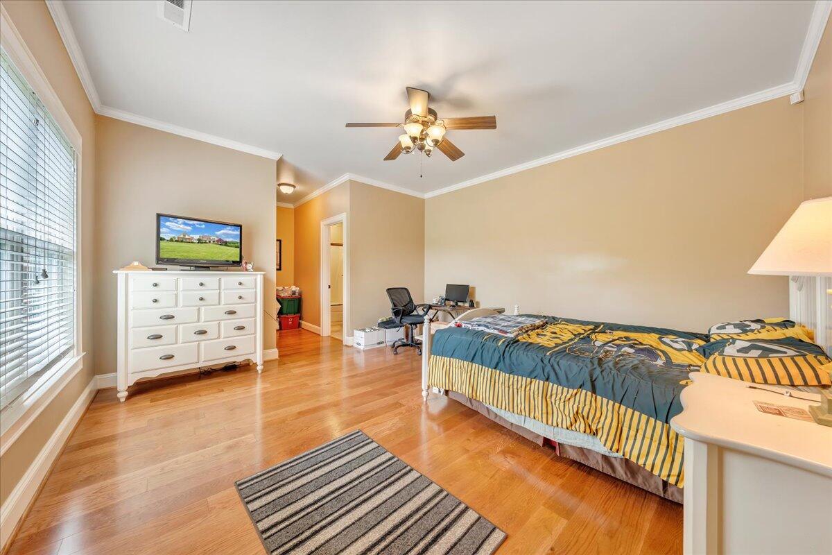 400 Quail Ridge Drive Fincastle, VA 24090 - Photo 57 of 113 a spacious bedroom with a bed and a walk in closet