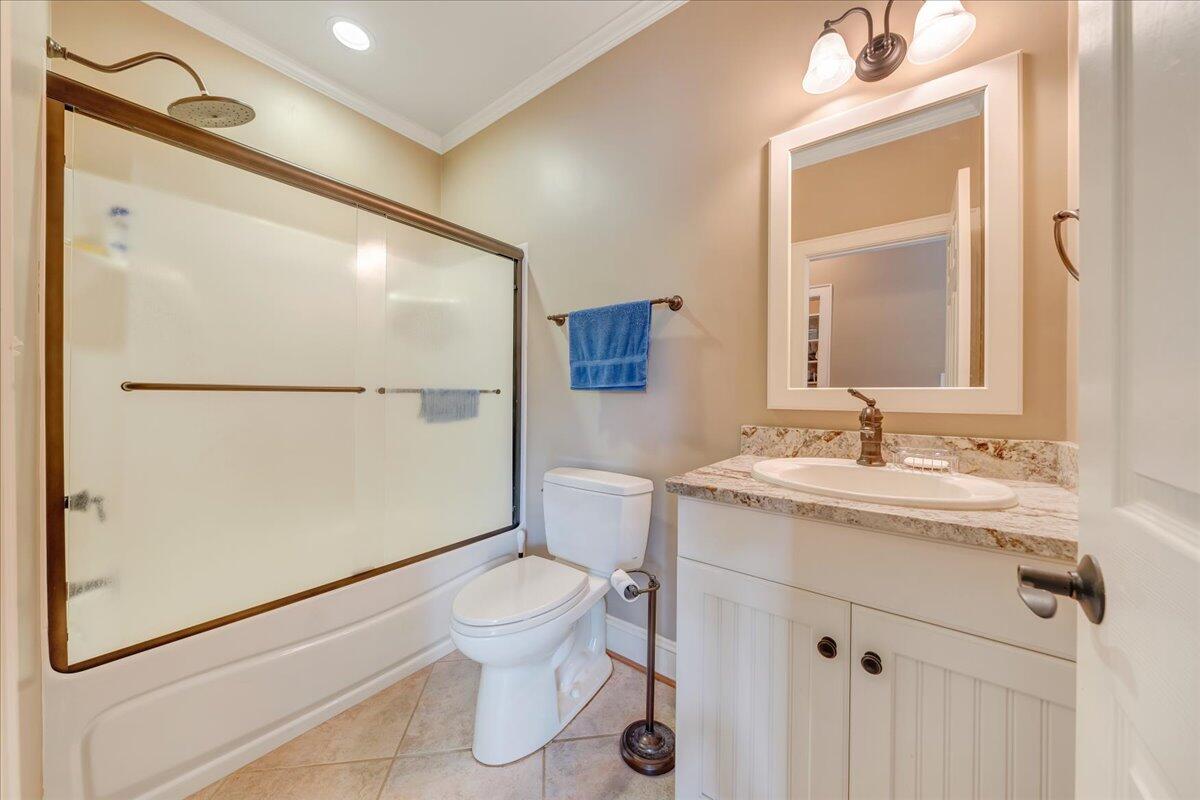 400 Quail Ridge Drive Fincastle, VA 24090 - Photo 58 of 113 a bathroom with a granite countertop sink toilet and shower
