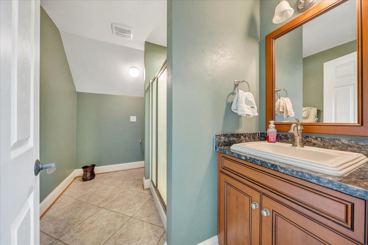 400 Quail Ridge Drive Fincastle, VA 24090 - Photo 62 of 113 a bathroom with a sink and a mirror