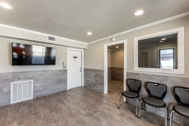 a living room with a fireplace and furniture