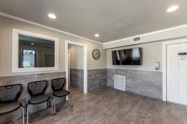 a living room with furniture and a flat screen tv