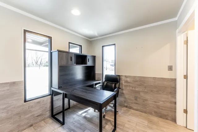 a living room with furniture pool table and window