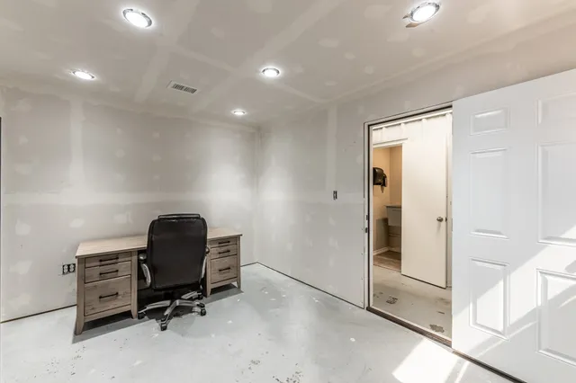 a view of workspace with wooden floor and windows