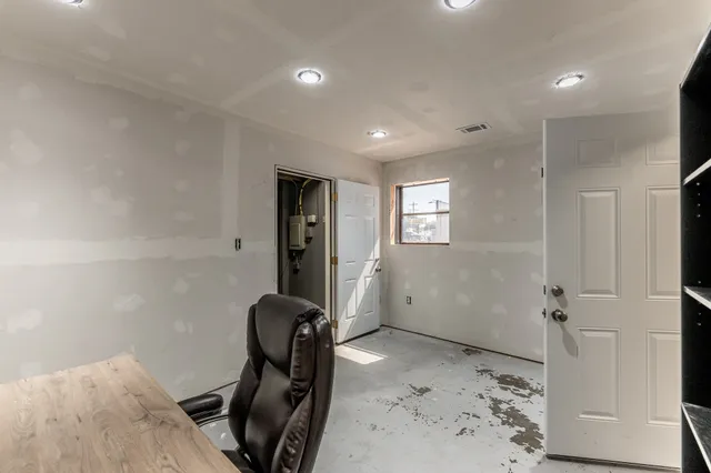 a view of a hallway with workspace