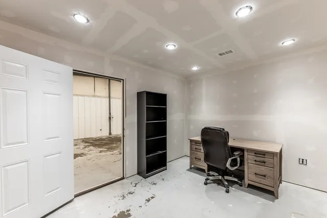 a view of a workspace with furniture