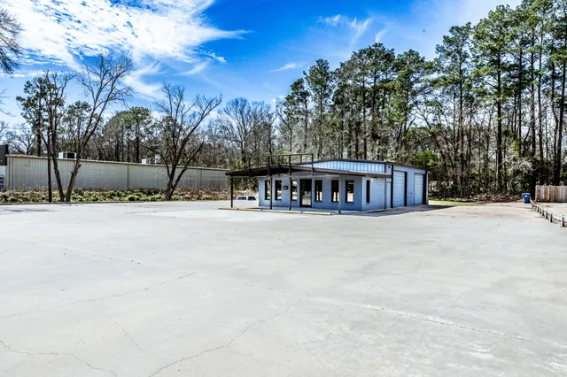 a view of swimming pool with trees in the background