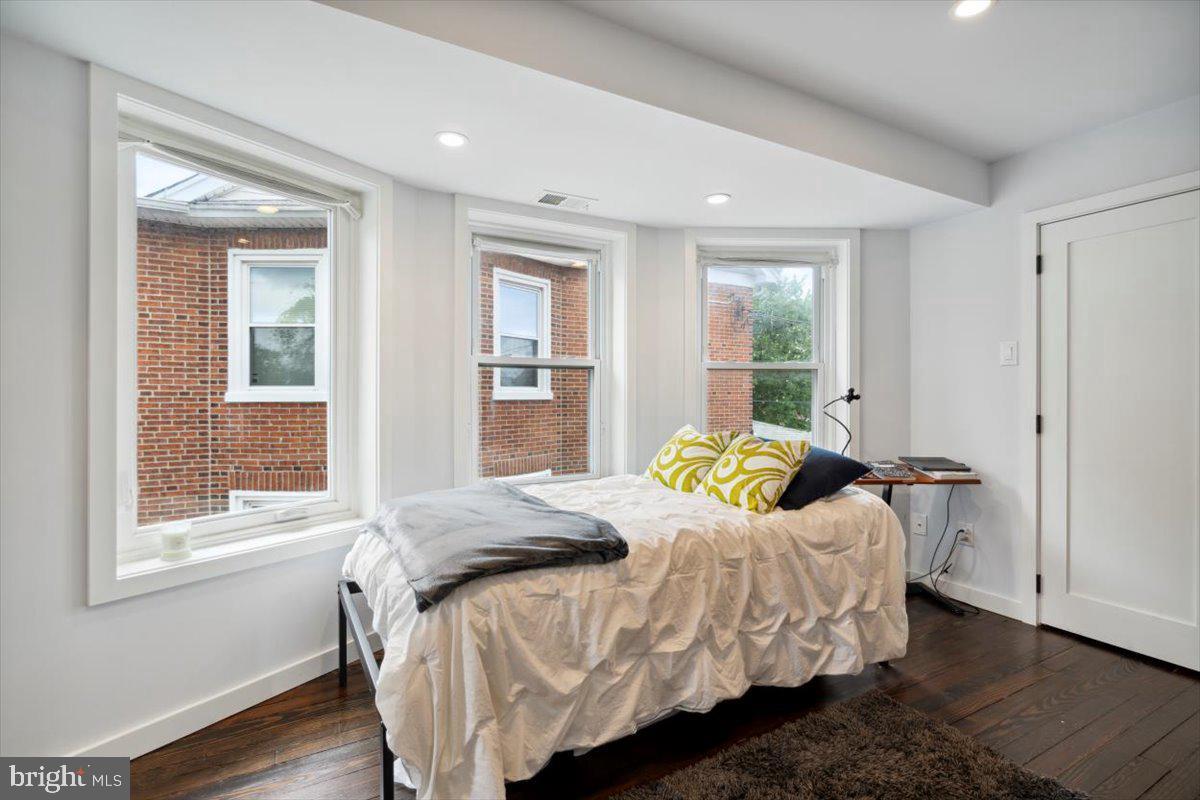 224 Edgemont Avenue Ardmore, PA 19003 - Photo 12 of 20 a bedroom with a bed and wooden floor
