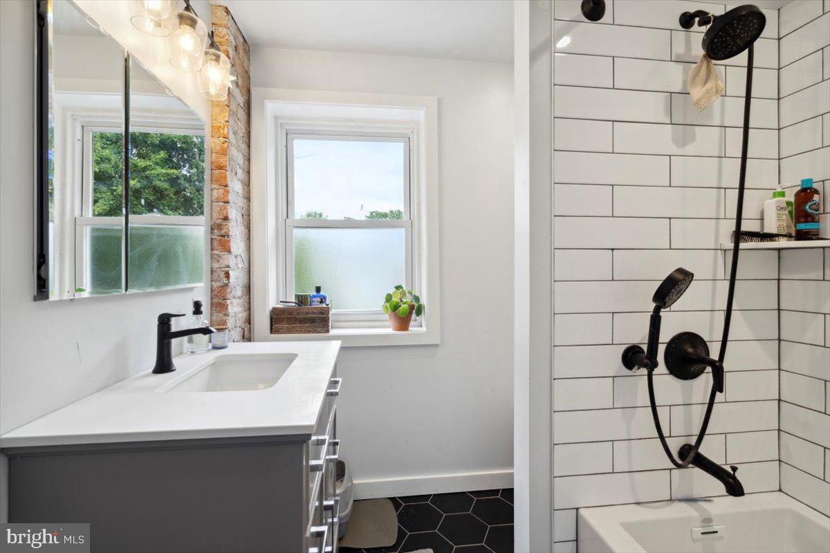 224 Edgemont Avenue Ardmore, PA 19003 - Photo 13 of 20 a bathroom with a sink and a shower