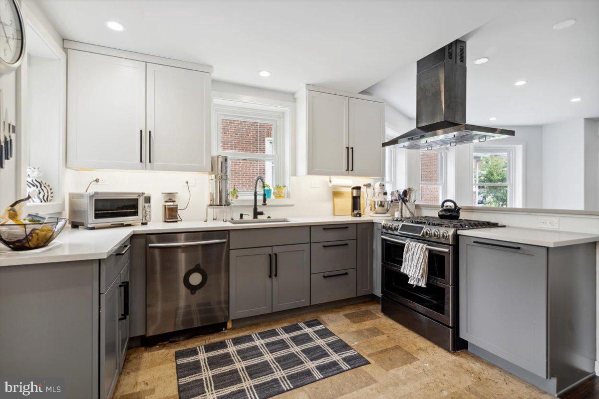 224 Edgemont Avenue Ardmore, PA 19003 - Photo 2 of 20 a kitchen with stainless steel appliances a sink stove and cabinets