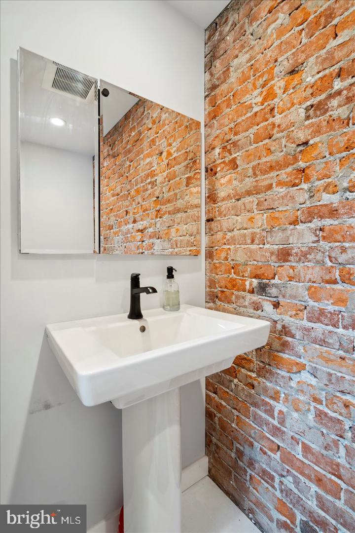224 Edgemont Avenue Ardmore, PA 19003 - Photo 6 of 20 a bathroom with a sink a vanity and a mirror