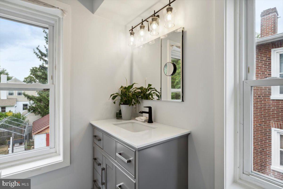 224 Edgemont Avenue Ardmore, PA 19003 - Photo 10 of 20 a bathroom with a sink and a mirror