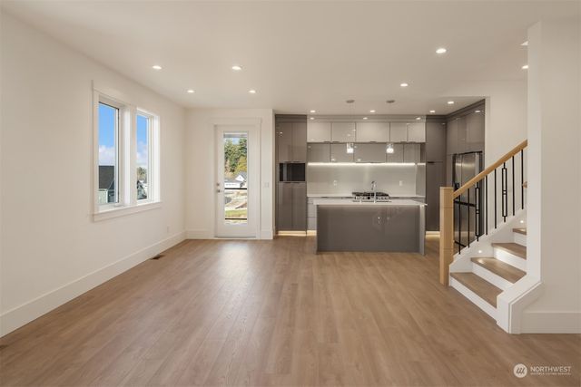 a view of a kitchen with furniture and a window