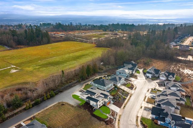an aerial view of a house with outdoor space