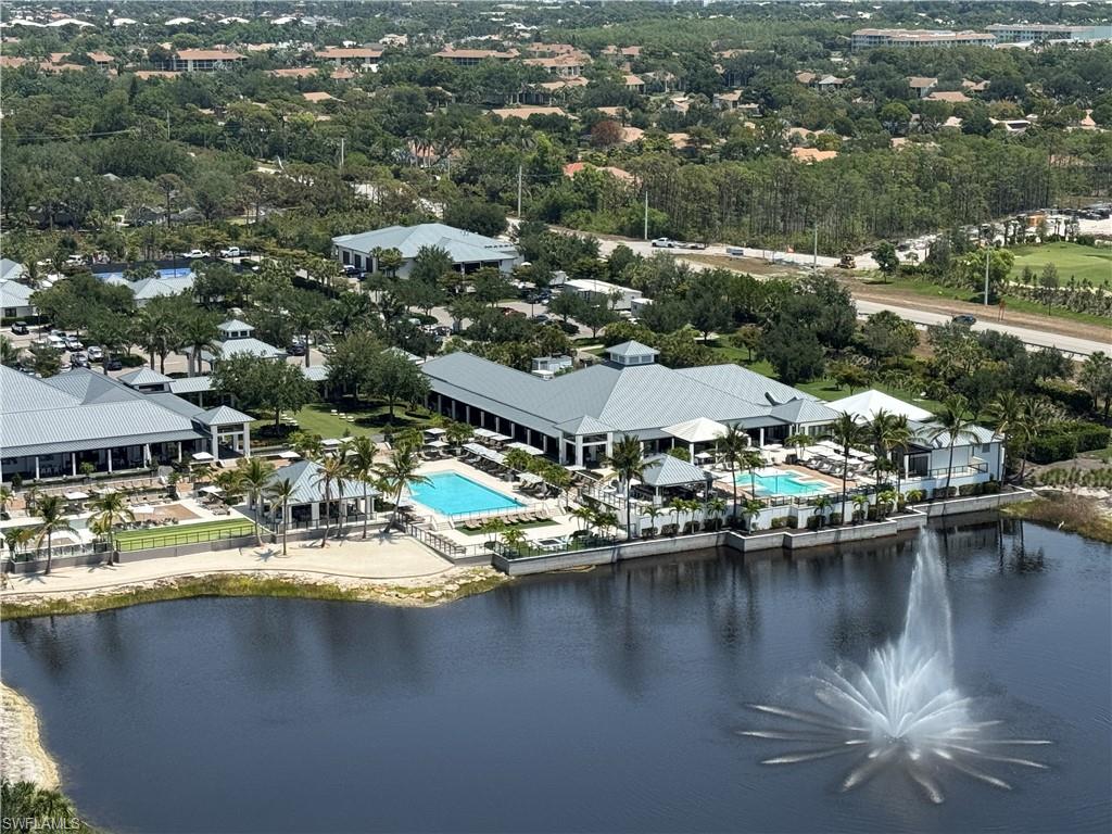 13925 Old Coast Road, Unit 2201 Naples, FL 34110 - Photo 20 of 28 an aerial view of residential houses with outdoor space and lake view