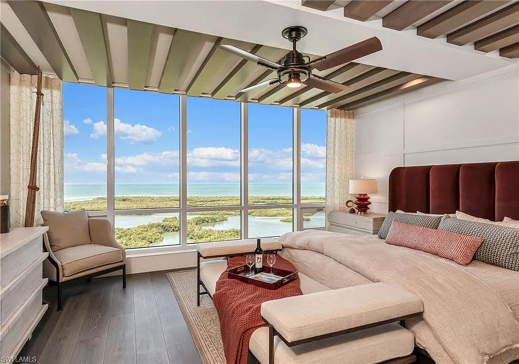 13925 Old Coast Road, Unit 2201 Naples, FL 34110 - Photo 9 of 28 a bedroom with furniture and a large window