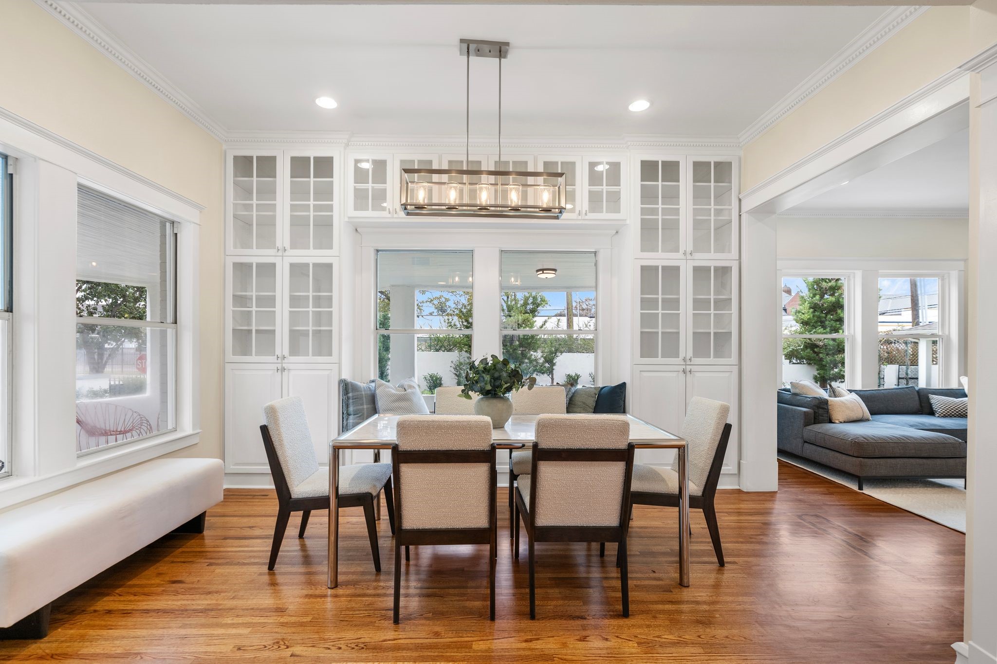607 Harvard Street Houston, TX 77007 - Photo 11 of 50 Plan your next dinner party under a contemporary chandelier and dentil crown molding in the beautiful formal dining room.