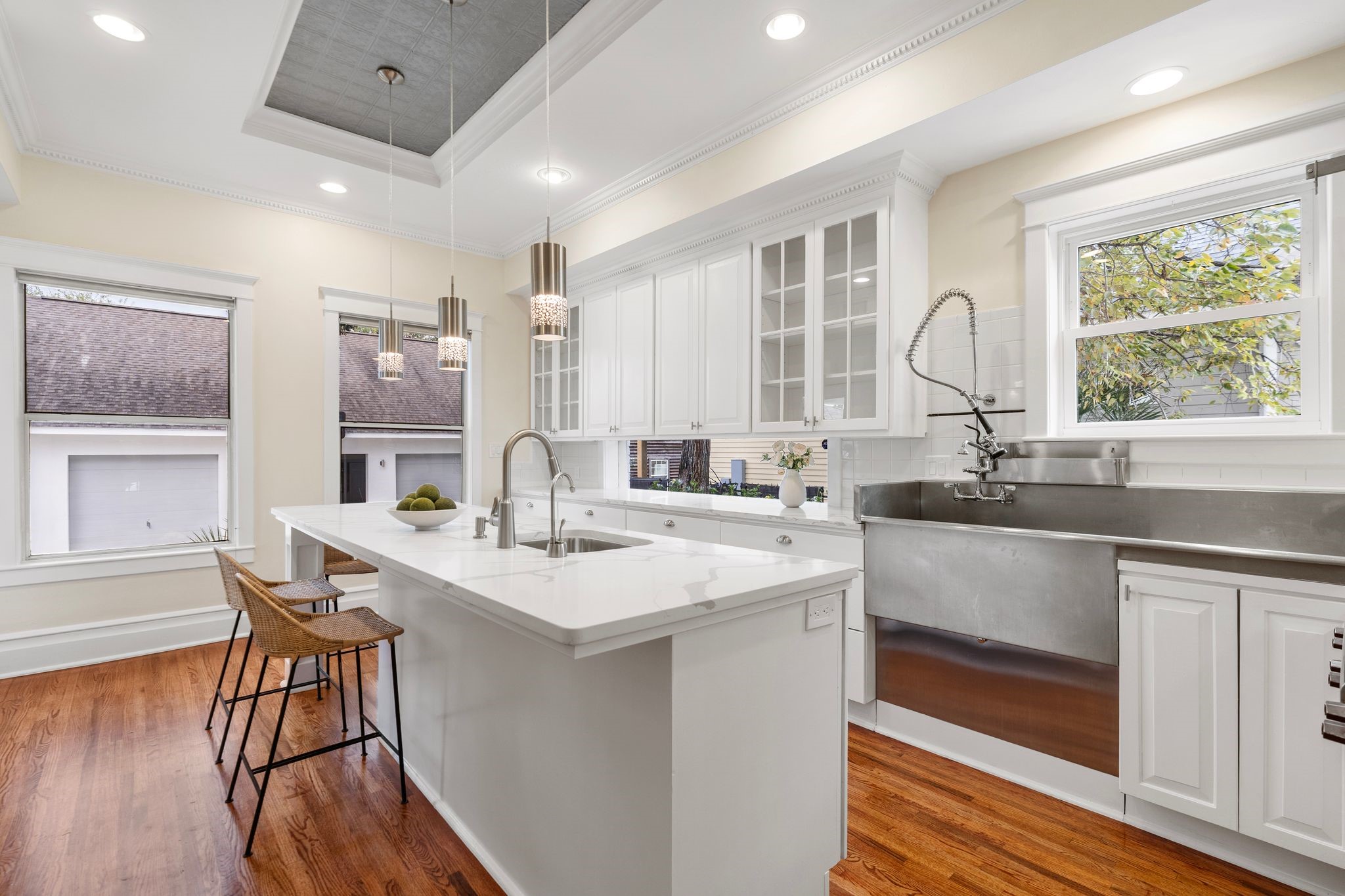 607 Harvard Street Houston, TX 77007 - Photo 18 of 50 Special touches like the built-in pot rack, prep sink, and industrial main sink with pull-down sprayer make this kitchen a joy to use.