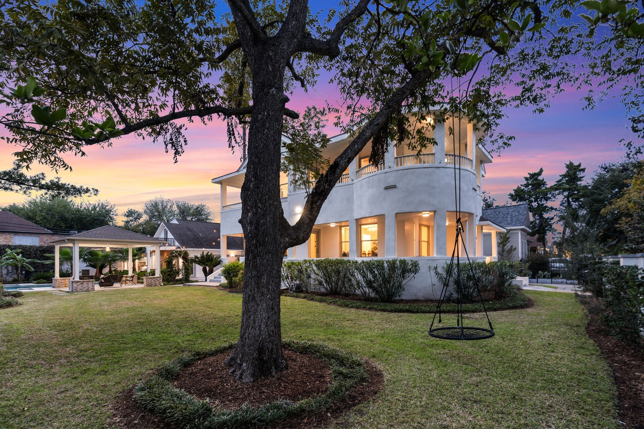 607 Harvard Street Houston, TX 77007 - Photo 42 of 50 A tree swing invites you to take in this truly special property combining an elegant period home, convenient ADU, and upscale poolside entertaining space.