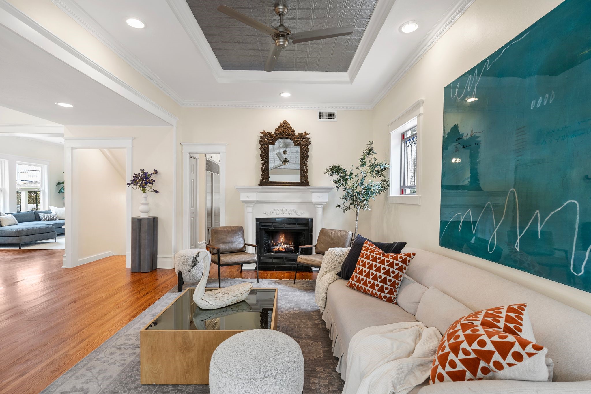 607 Harvard Street Houston, TX 77007 - Photo 8 of 50 Greet guests in the formal front living room, where a tall tin tray ceiling rises above hardwood floors refinished this year.