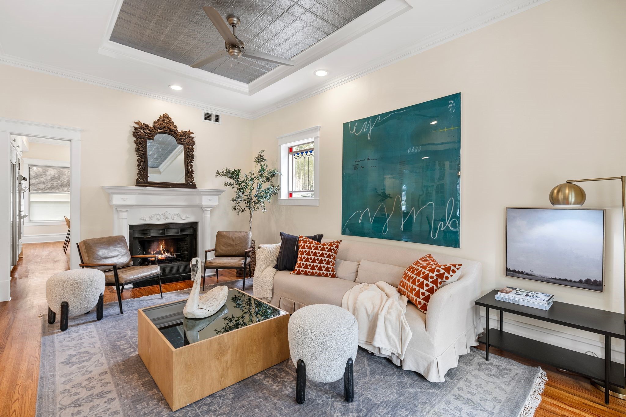 607 Harvard Street Houston, TX 77007 - Photo 9 of 50 Stained glass details, handsome millwork and an ornate wood-burning fireplace mantel add an air of elegant refinement to this meticulously maintained 1920 residence.