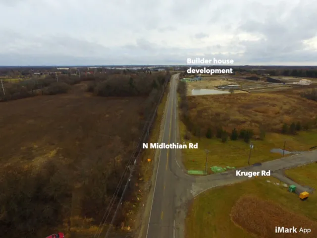a view of a swimming pool and an outdoor seating
