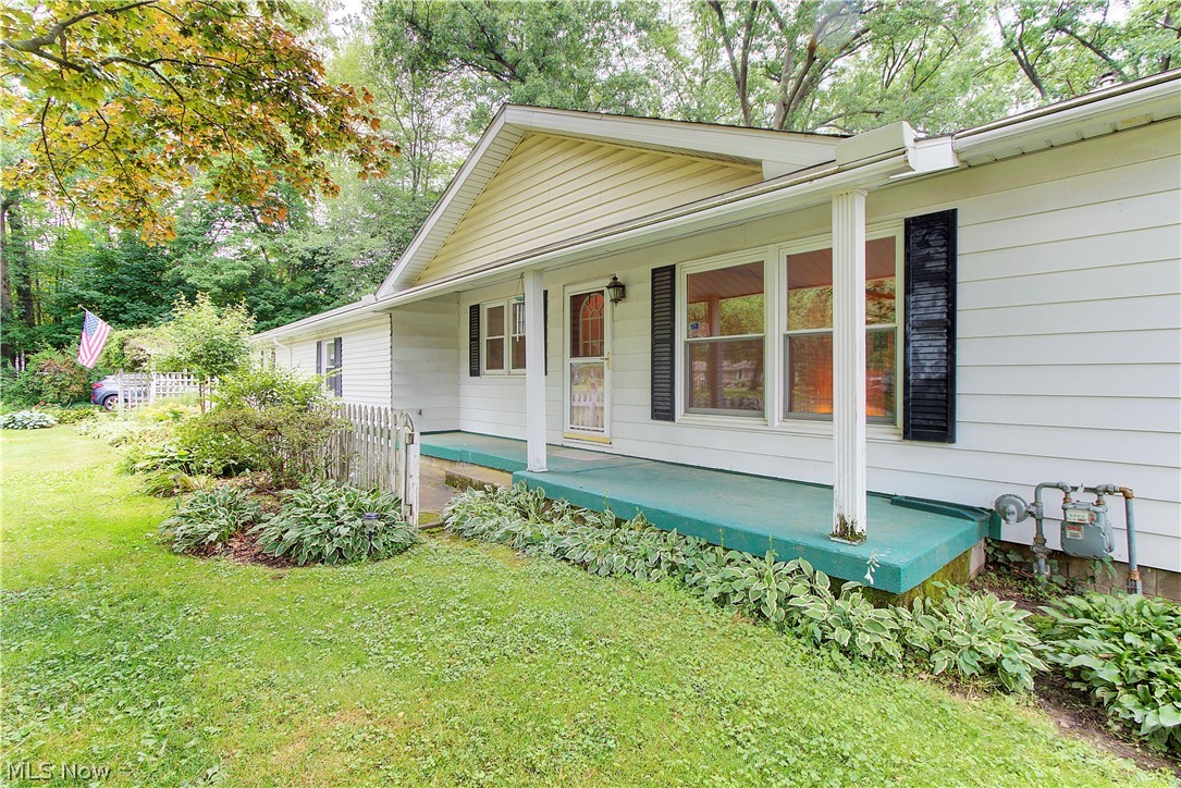 5839 Myers Road New Franklin, OH 44319 - Photo 4 of 34 Front porch has ample space for seating to watch the sunset!
