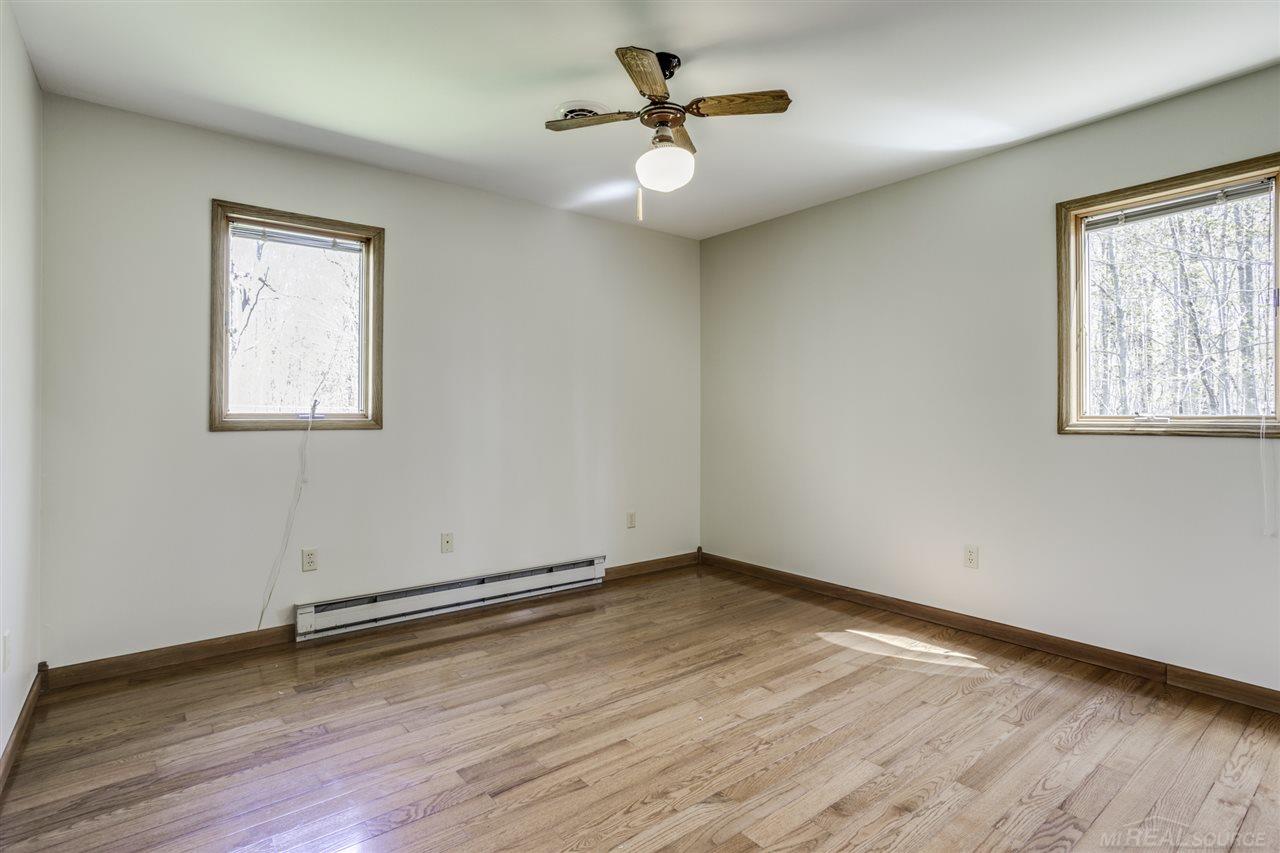 3629 Fargo Road Croswell, MI 48422 - Photo 18 of 34 Bedroom One with Hardwood Floors