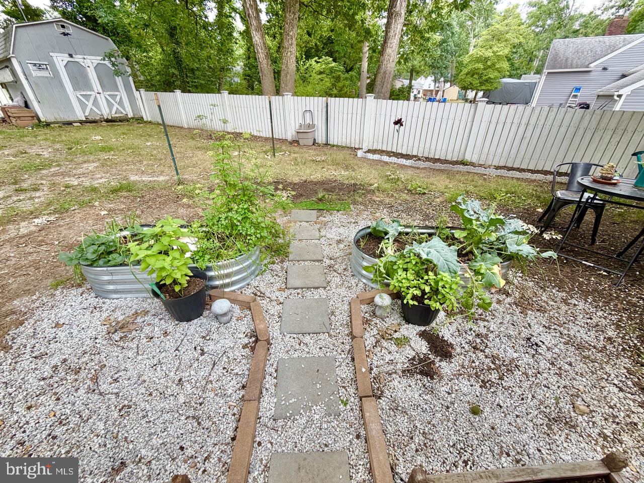 2413 Shelburn Road Millville, NJ 08332 - Photo 39 of 41 a view of a garden with wooden fence